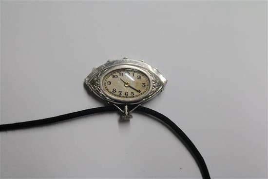 An Art Deco style white metal, diamond and black onyx set fan shaped pendant watch, on a fabric necklace, watch 30mm.